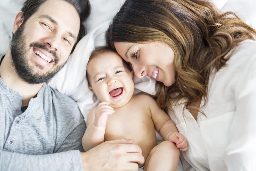 Citizenship of a child born in another country: happy parents with their newborn child